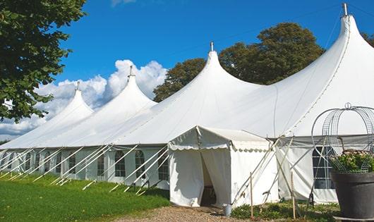 a line of sleek and modern portable toilets ready for use at an upscale corporate event in Rodeo